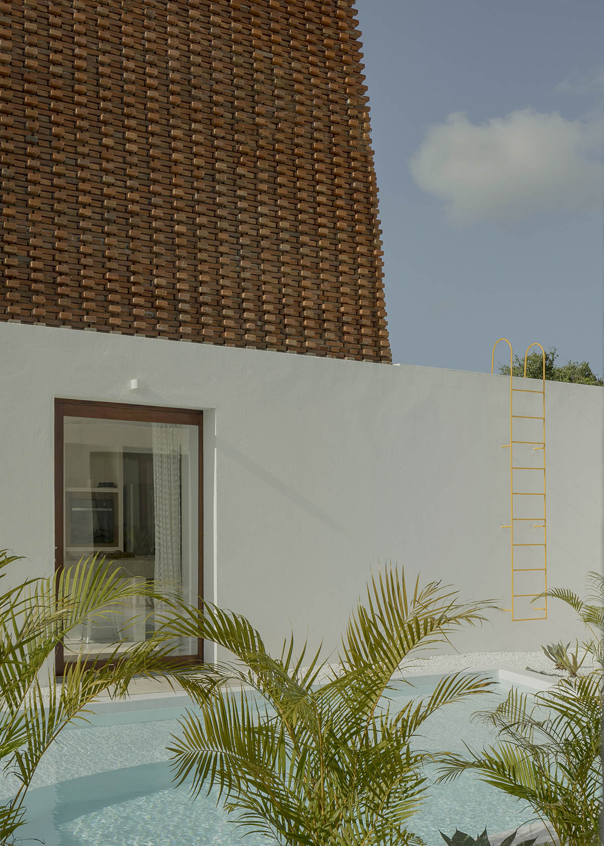 Atelier Matteo Arnone adds spacious brick tower to holiday home in Brazilian forest