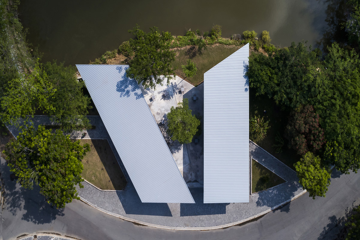 Hexagonal pavilions are hidden under V-shaped roofs that look like a pair of bird wings in Vietnam
