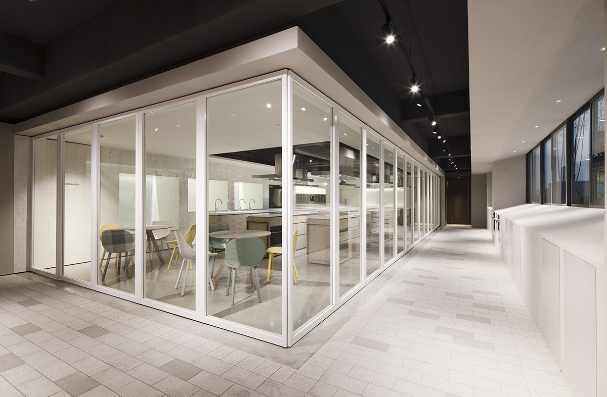 Lukstudio created artificial culinary village from different homes with monochrome interior