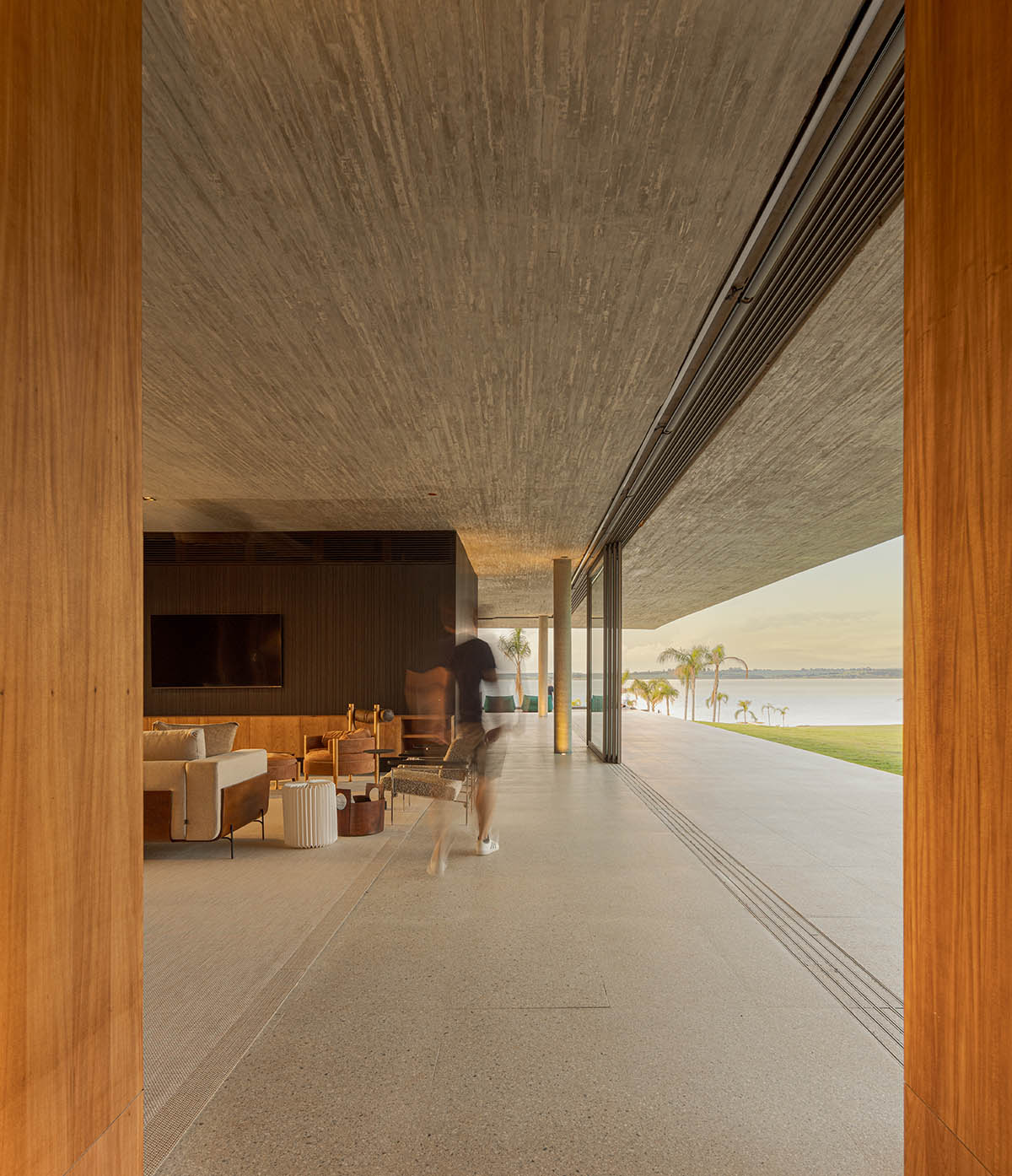 T-shaped weekend house by mf+arquitects is blended with its natural surroundings in São Paulo 