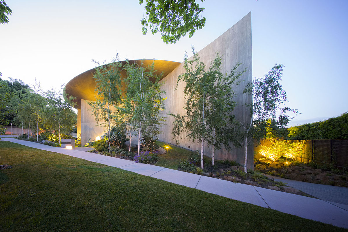 Wood Marsh built sculptural Towers Road House that features disc-shaped zinc roof in Toorak