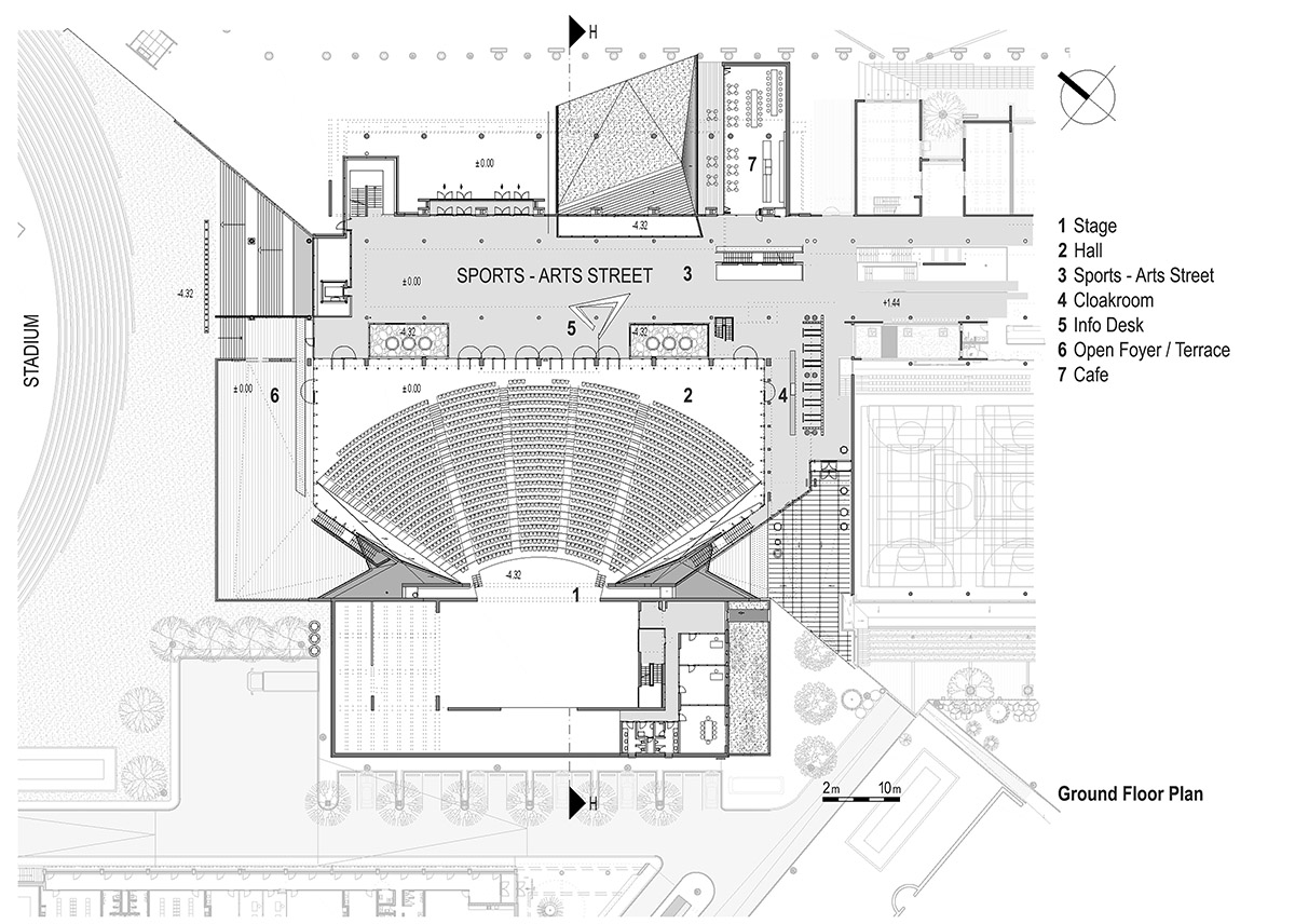 Uygur Architects articulates performing arts center façade with wooden triangulating surfaces