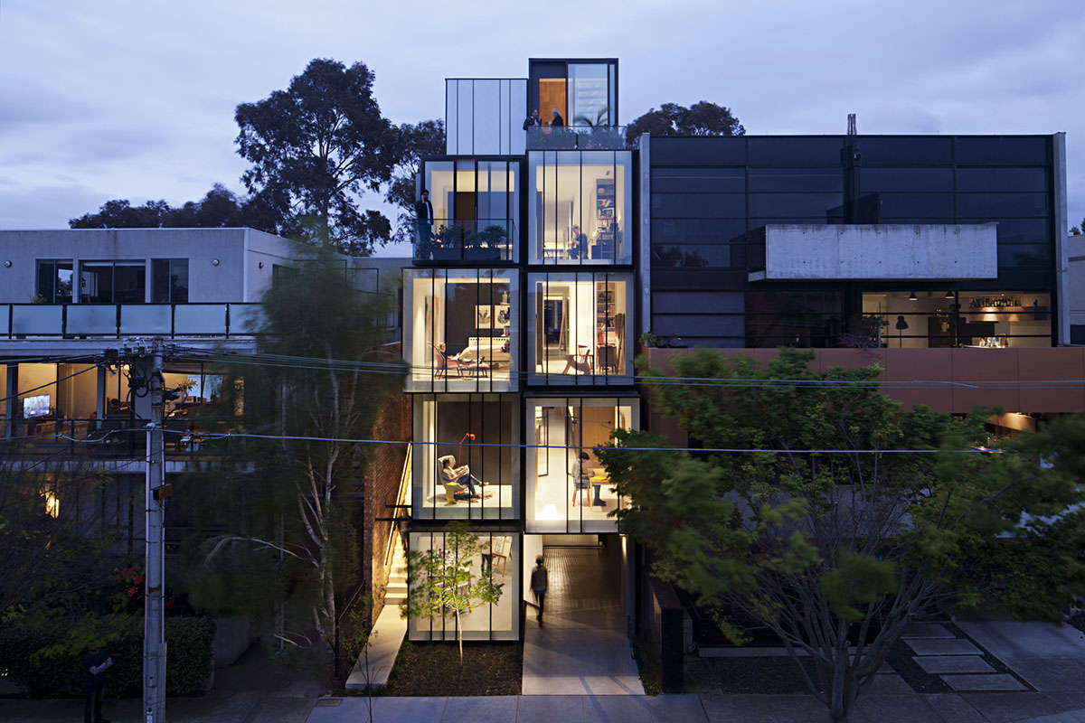 Protruding glass boxes form mixed-use housing in a narrow plot in Melbourne