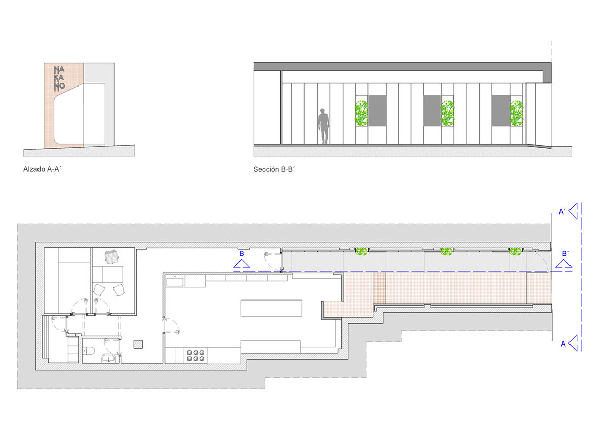 A takeaway restaurant is bathed in orange light with its linear entrance in Alicante