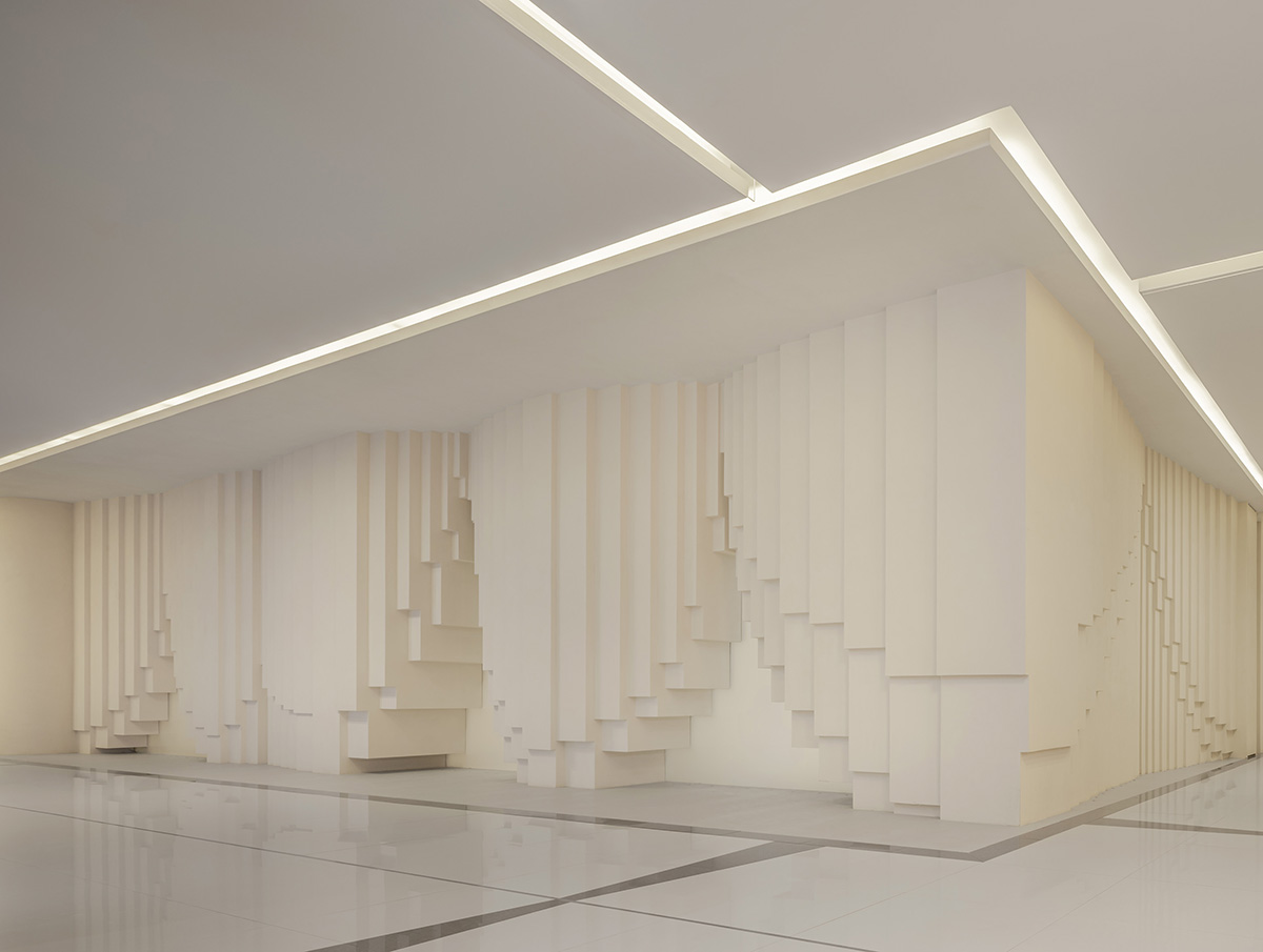 Simple Cuisine Gallery mimics waterfalls, with flowing facades that evoke water movement in China 