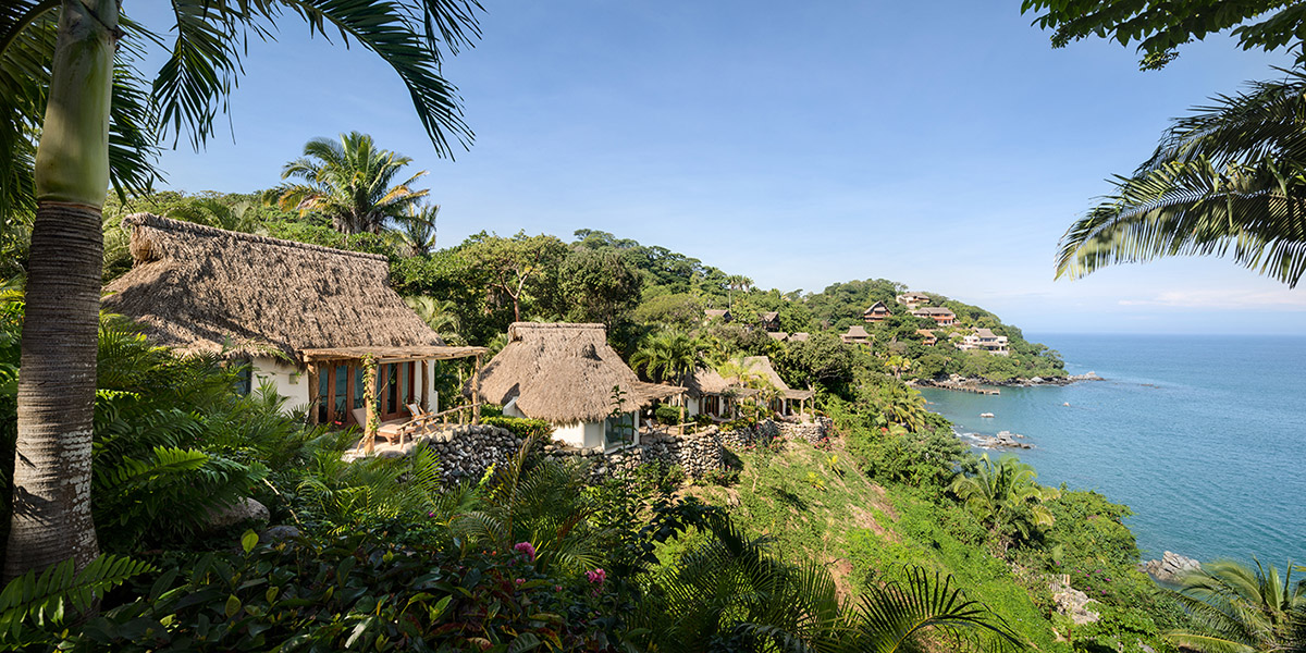 MAIN OFFICE adds half-circle yoga platform to thatched-roof guest villas in Sayulita, Mexico