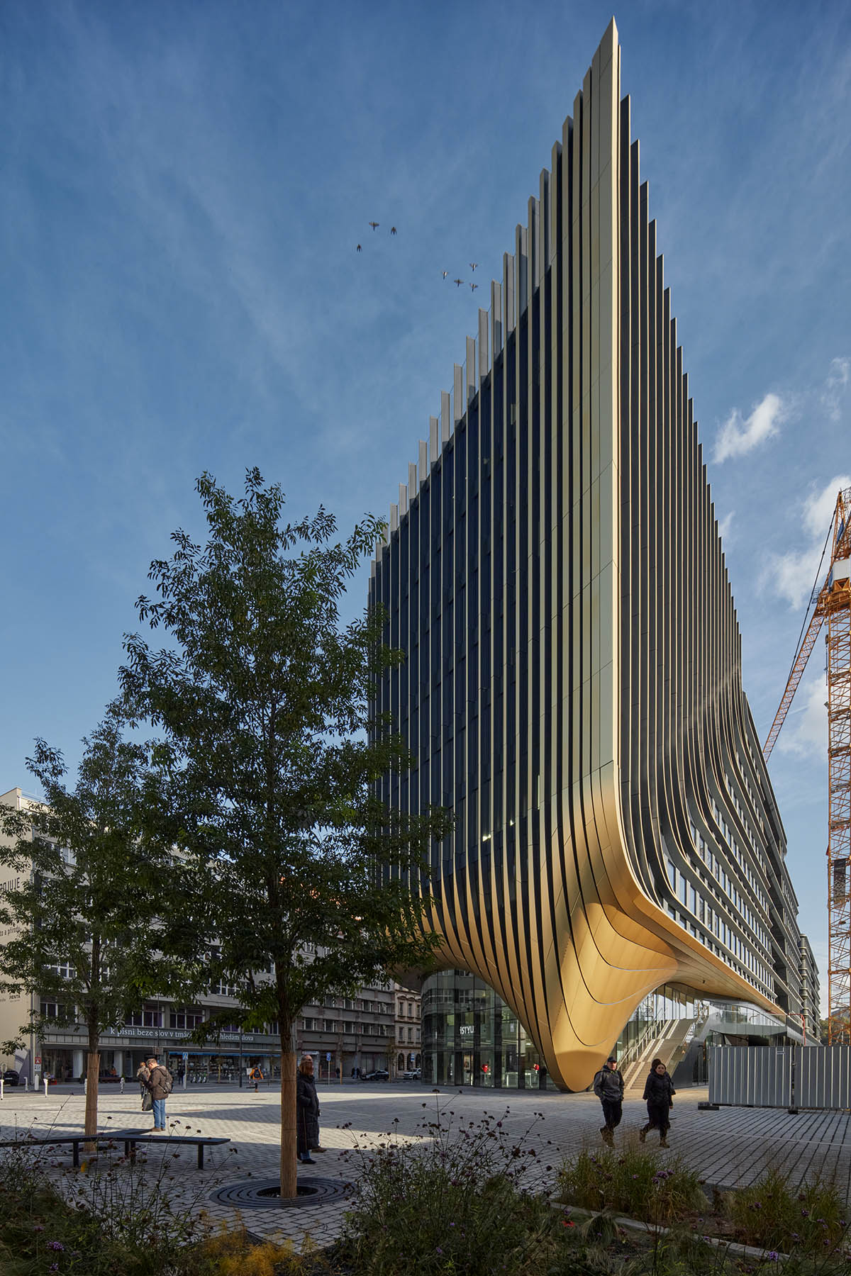 Zaha Hadid Architects completes Masaryčka building with golden vertical fins in Prague