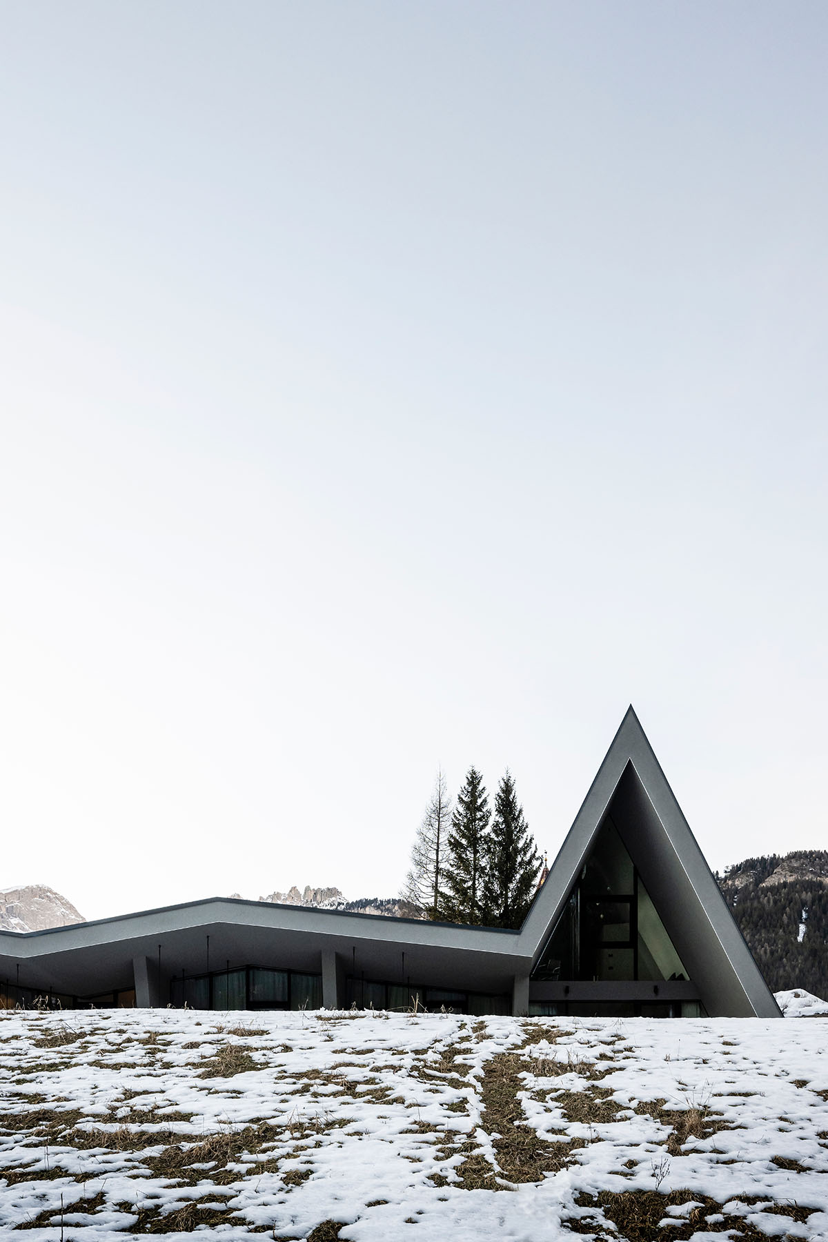 Zigzag roof defines character of Olympic Spa Hotel by NOA in the Alpine meadow