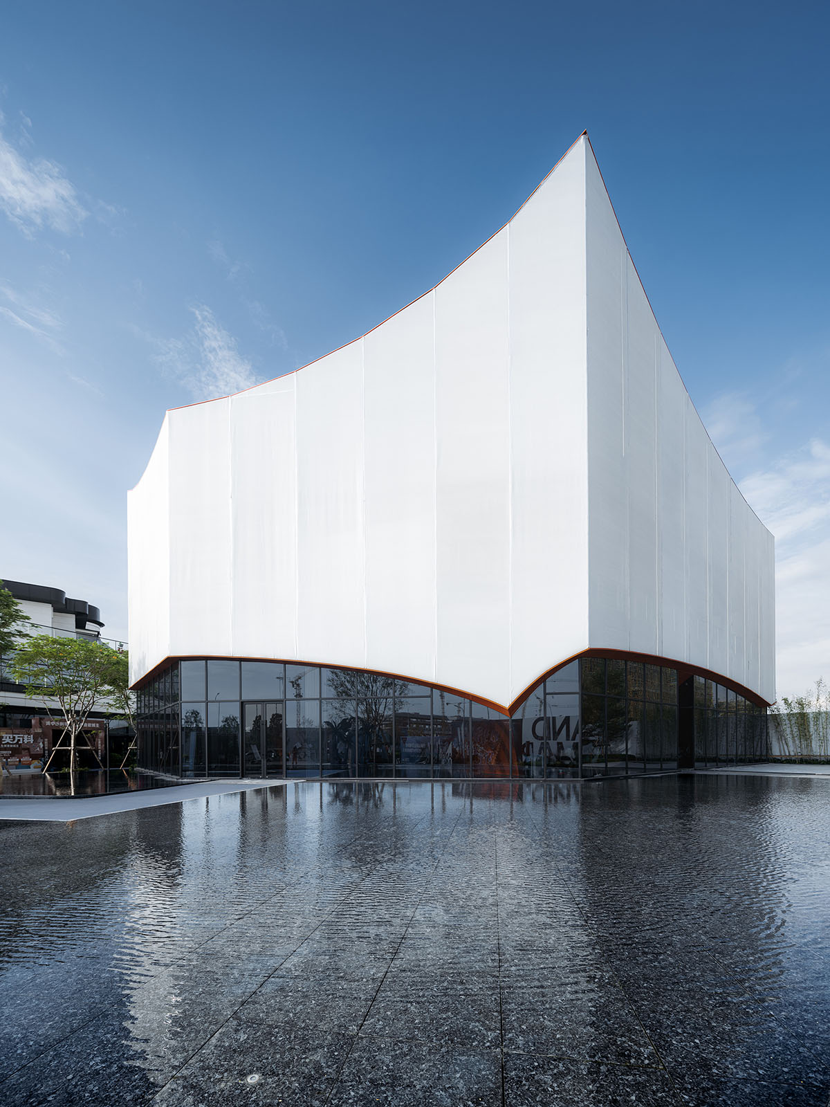 Wutopia Lab built showroom evoking Chinese red mountains with dazzling orange-colored roof