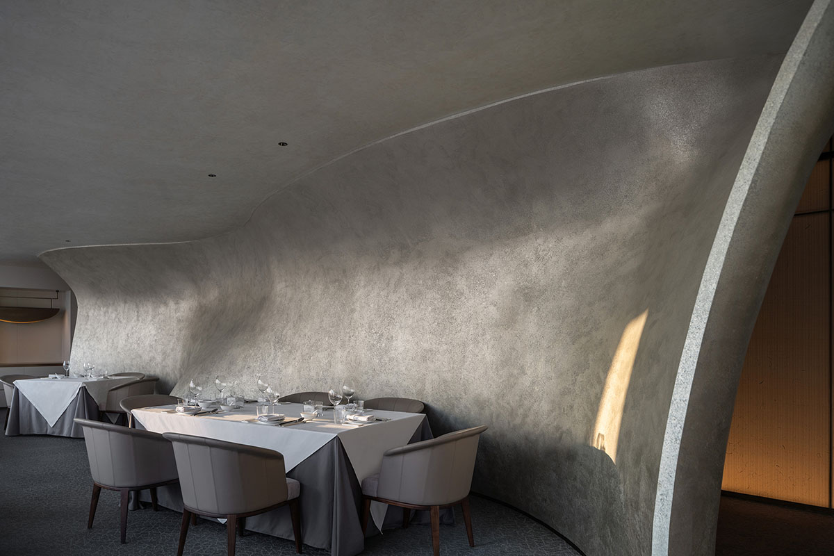 Nature Times Art Design completes restaurant with cave-like wall and garden-themed hall in Hangzhou