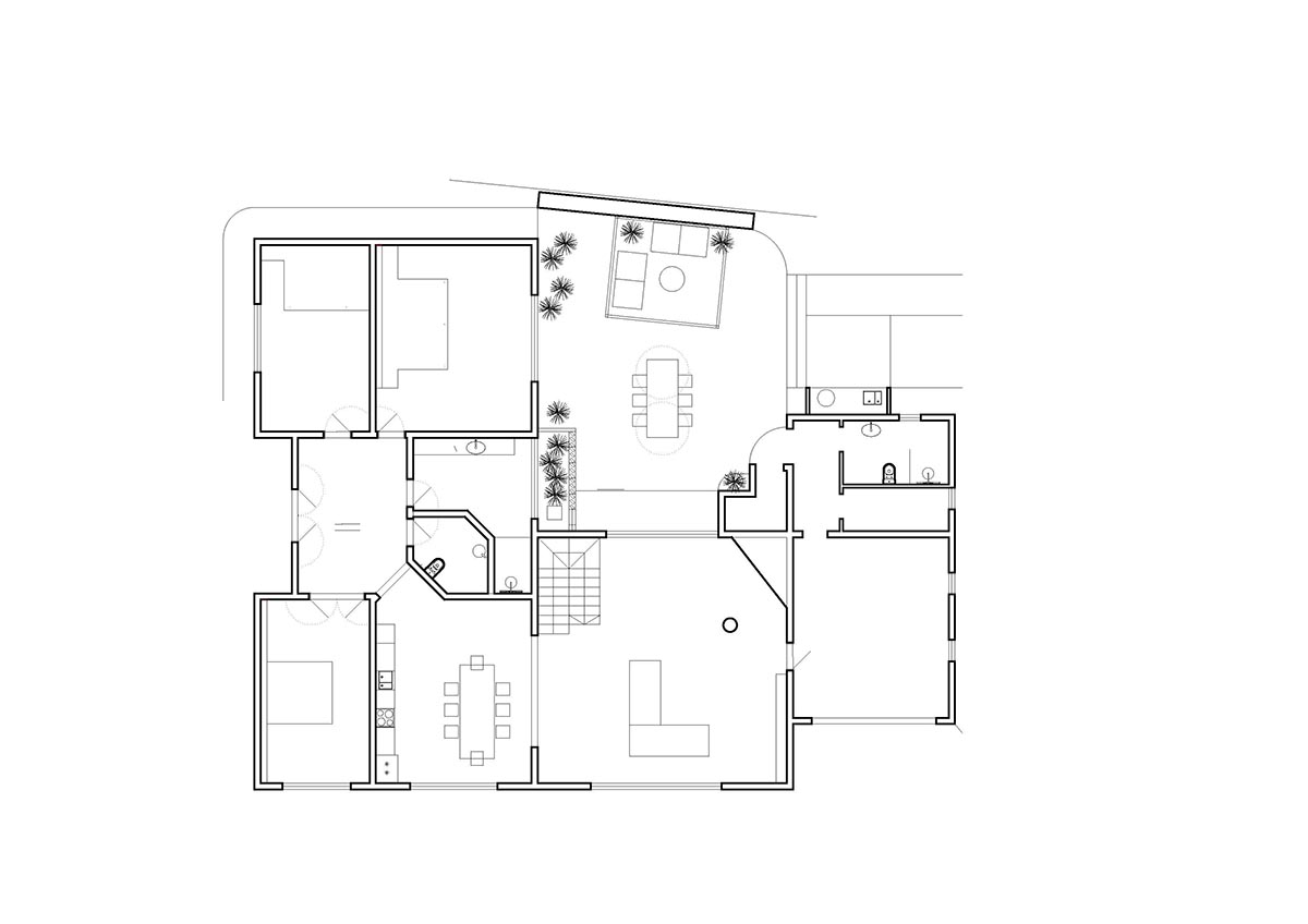 Lava-black landscape and palm trees inform this all-white house by OOOOX in Spain 