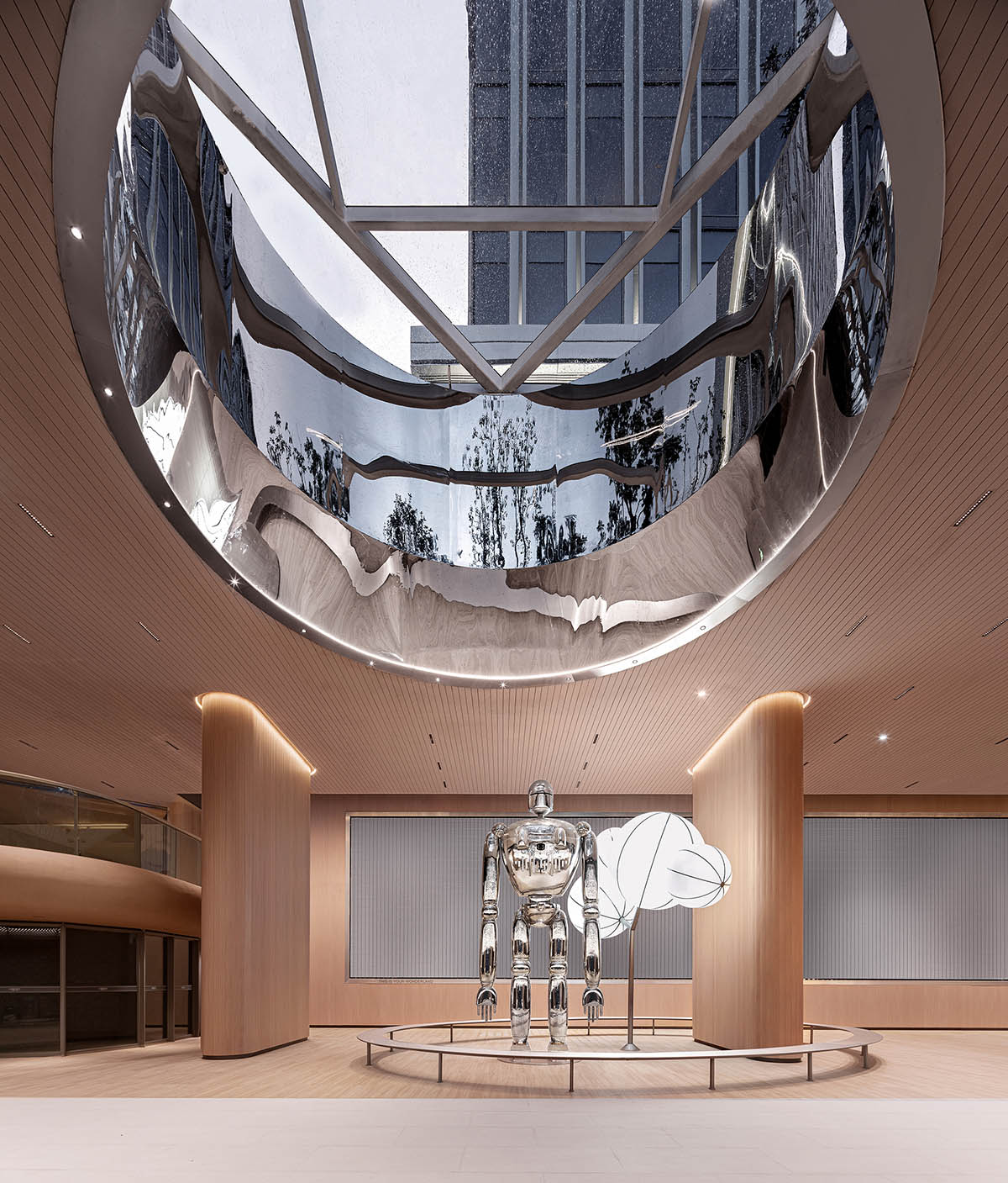 TOMO Design creates interiors for metro station with soft wood hues and circular light strip