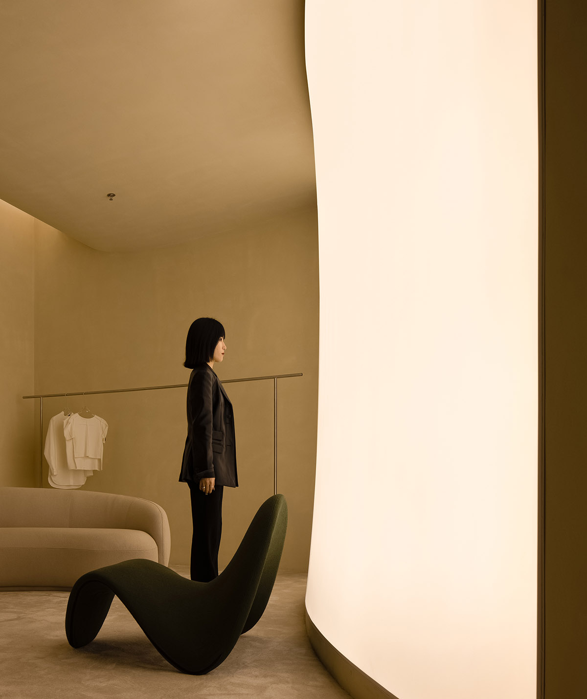 AD ARCHITECTURE designs store with light yellow curved walls that create comfort and softness 