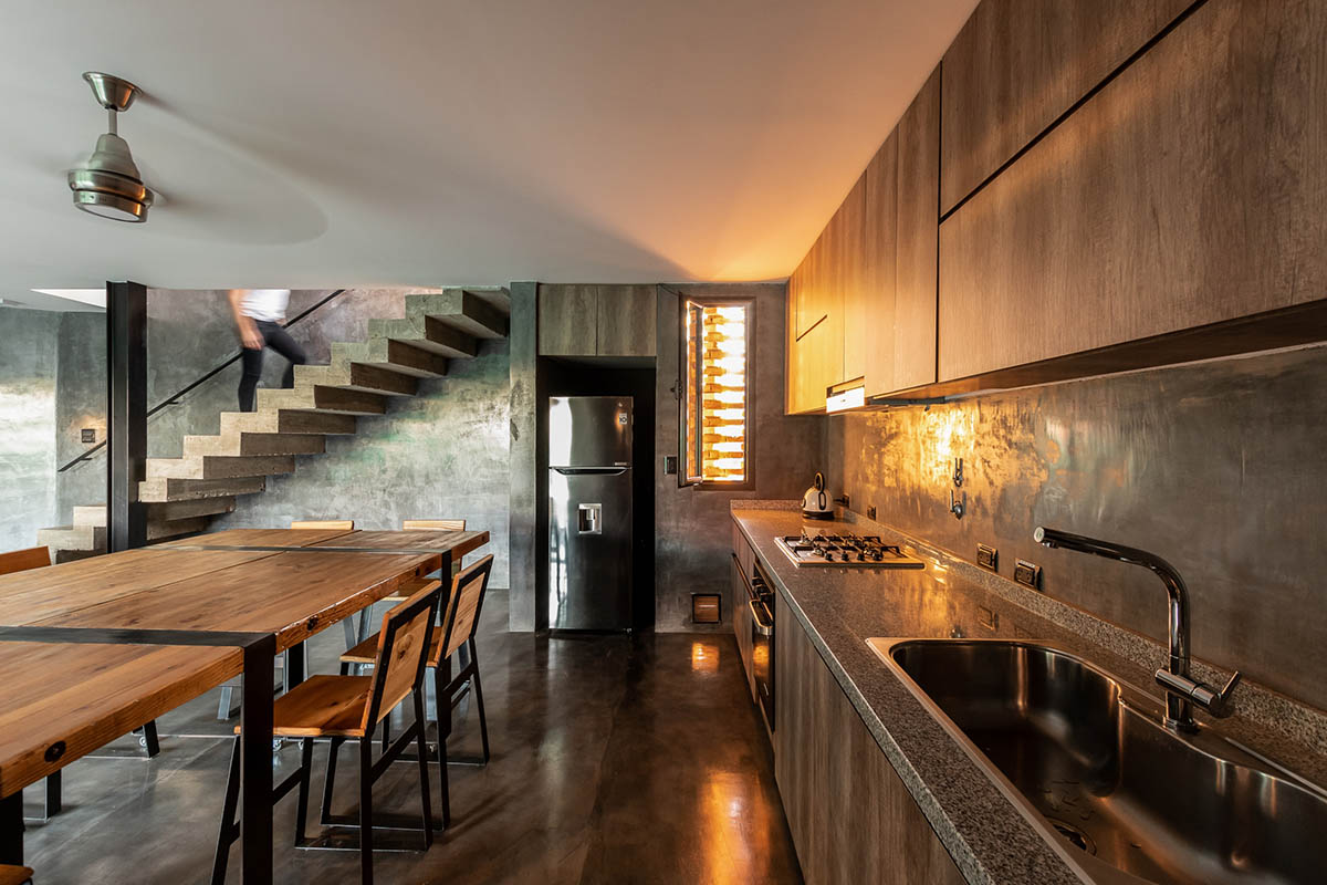 3D layer of brick wall wraps this family house to provide thermal comfort and special texture