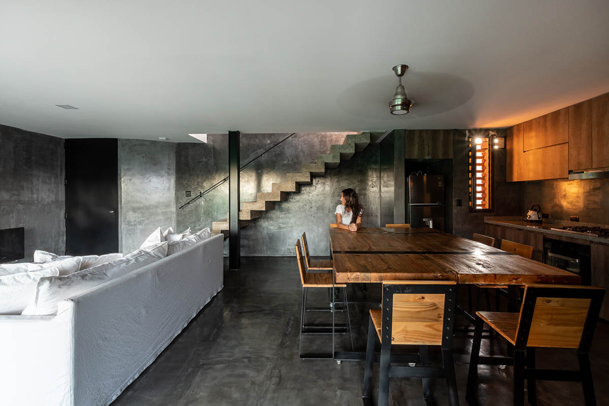 3D layer of brick wall wraps this family house to provide thermal comfort and special texture