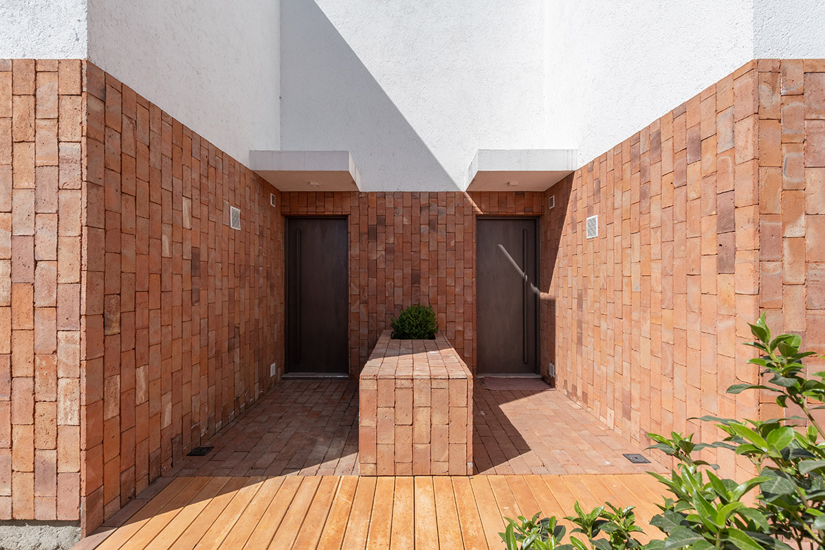 Andres Alonso Architecture Workshop completes La Inesita houses with tall brick base in Cordoba