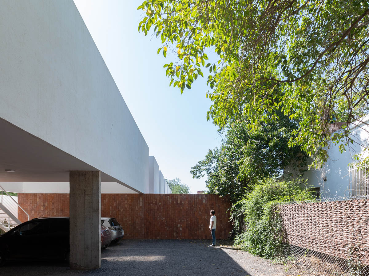 Andres Alonso Architecture Workshop completes La Inesita houses with tall brick base in Cordoba