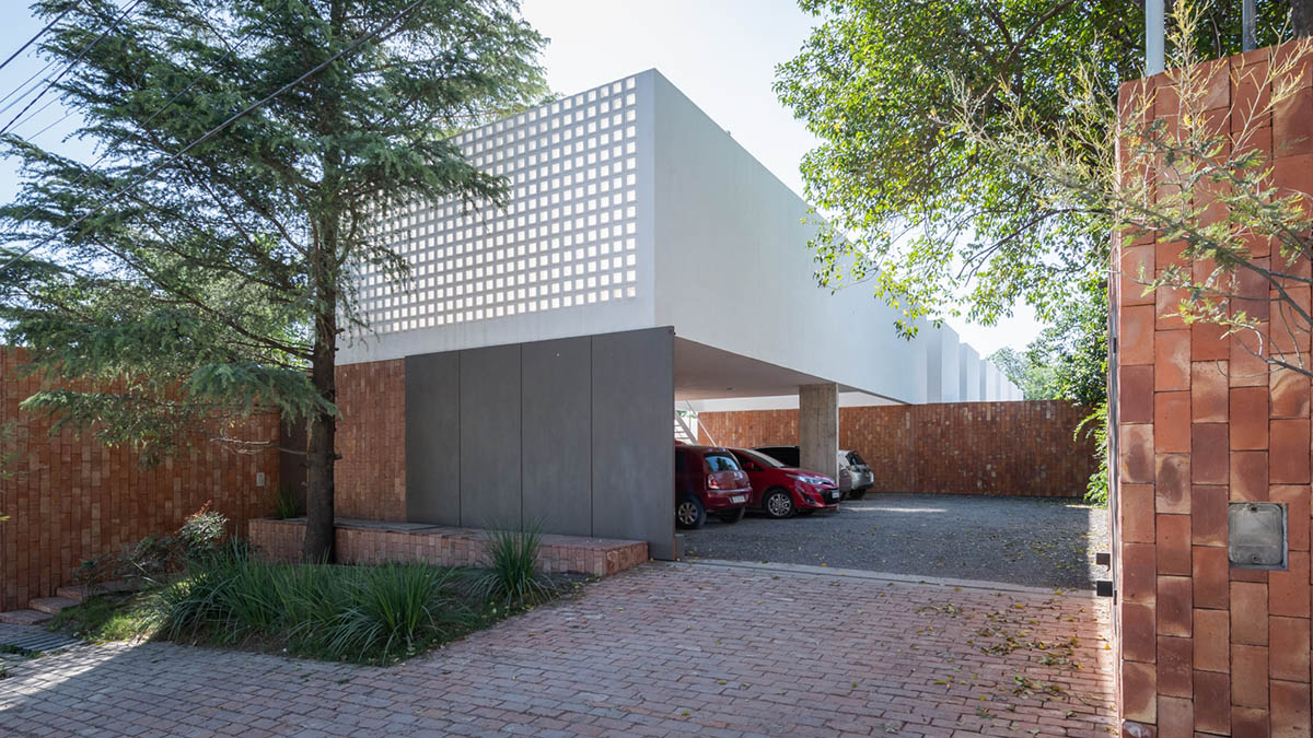 Andres Alonso Architecture Workshop completes La Inesita houses with tall brick base in Cordoba