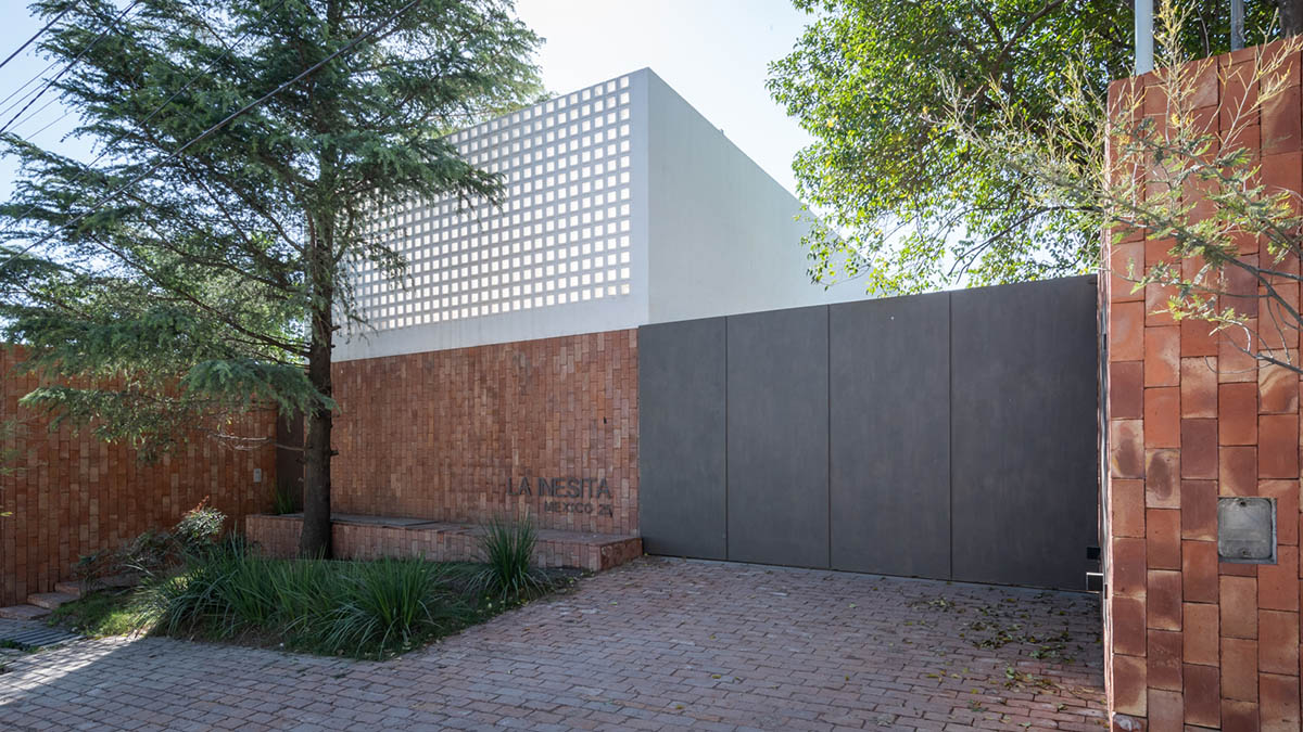 Andres Alonso Architecture Workshop completes La Inesita houses with tall brick base in Cordoba