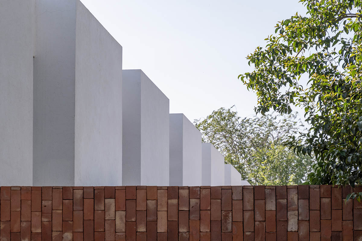 Andres Alonso Architecture Workshop completes La Inesita houses with tall brick base in Cordoba