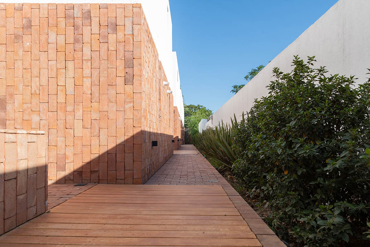 Andres Alonso Architecture Workshop completes La Inesita houses with tall brick base in Cordoba
