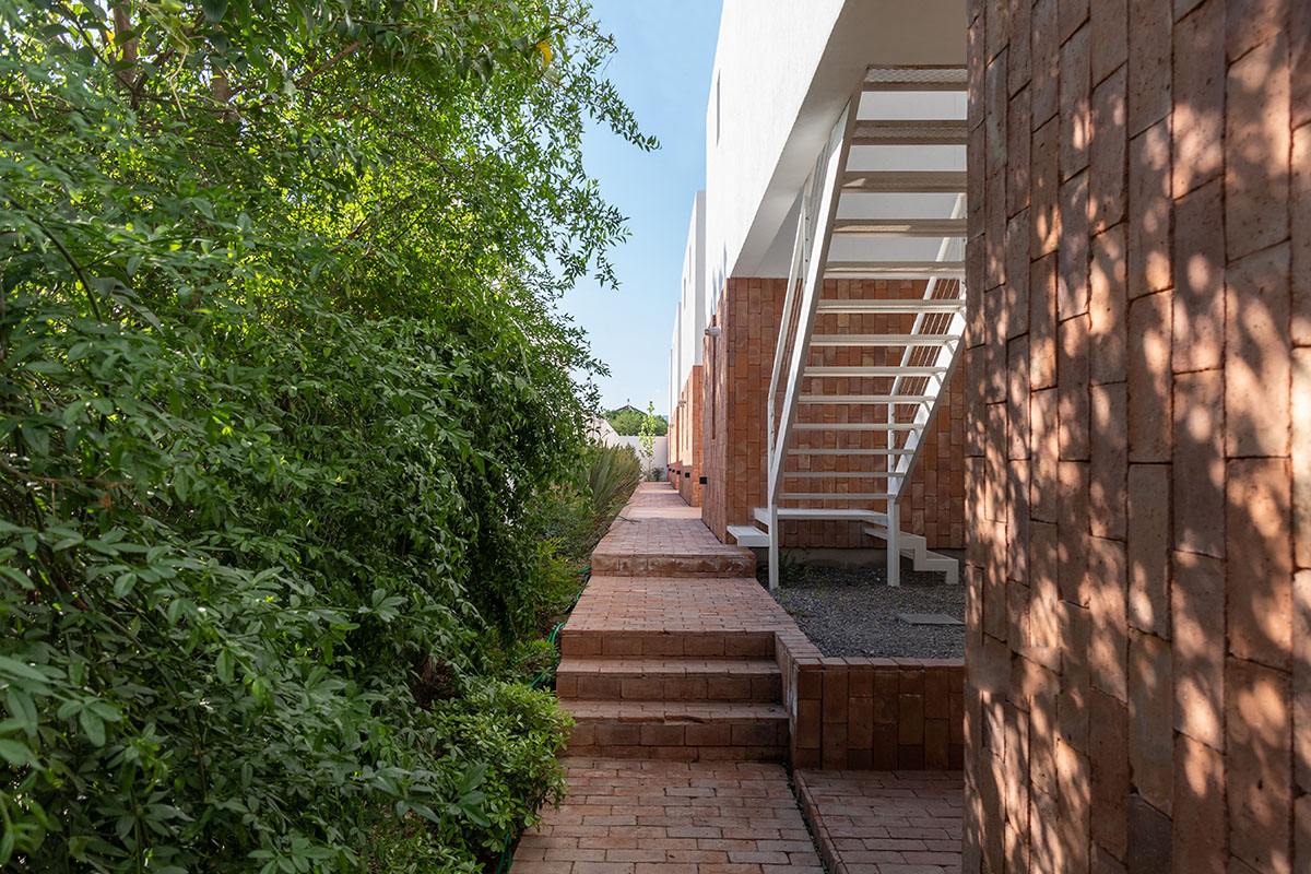 Andres Alonso Architecture Workshop completes La Inesita houses with tall brick base in Cordoba