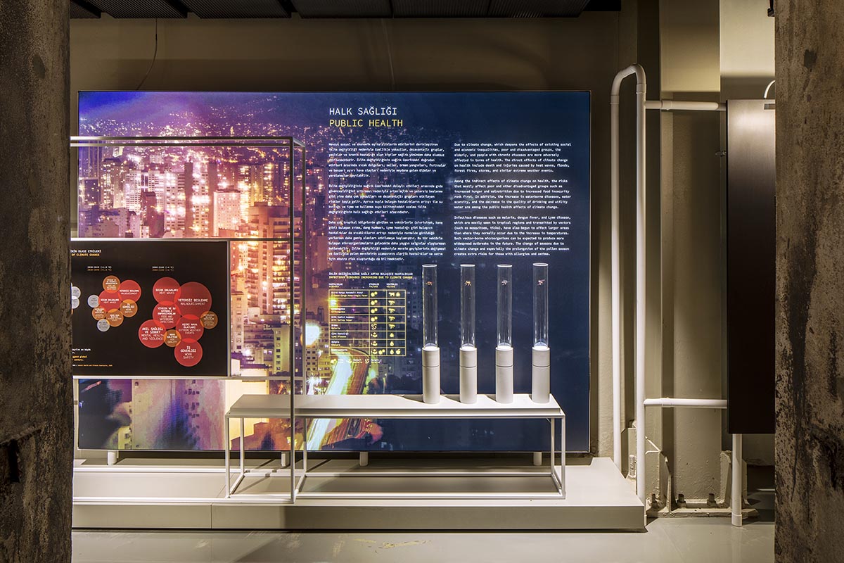 do[x]architecture softens robust industrial look of climate museum with colorful boards and lights