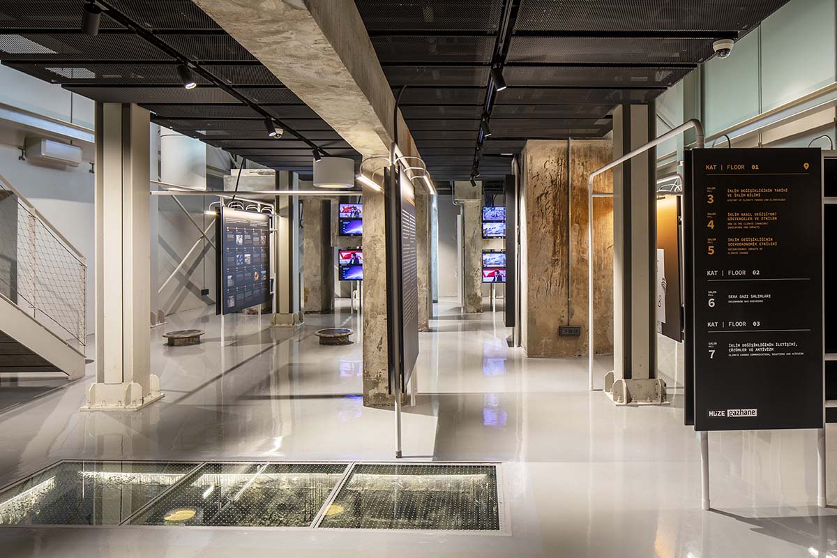 do[x]architecture softens robust industrial look of climate museum with colorful boards and lights