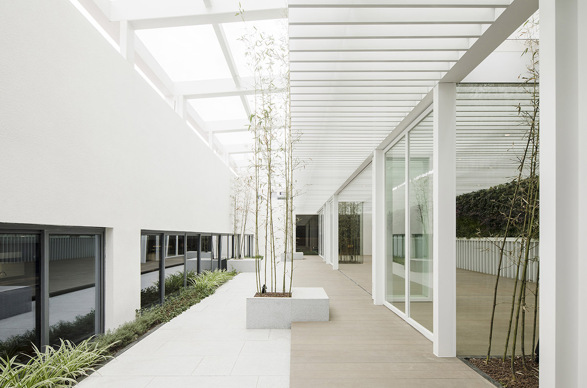 Lukstudio created artificial culinary village from different homes with monochrome interior