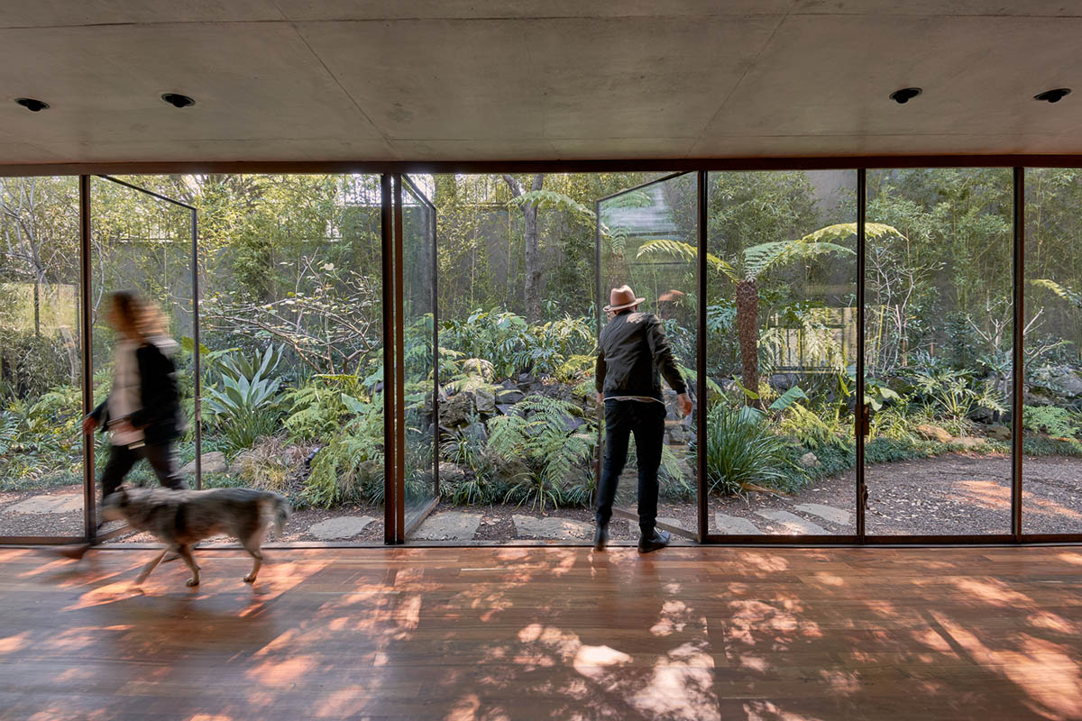 Triangular and faceted green terraces provide generous open spaces for this residence by Vertebral