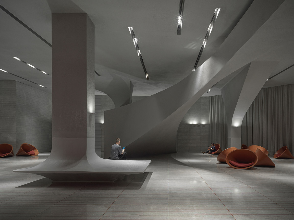 Greyscale interior provides acoustically comfortable space for a cinema by One Plus Partnership
