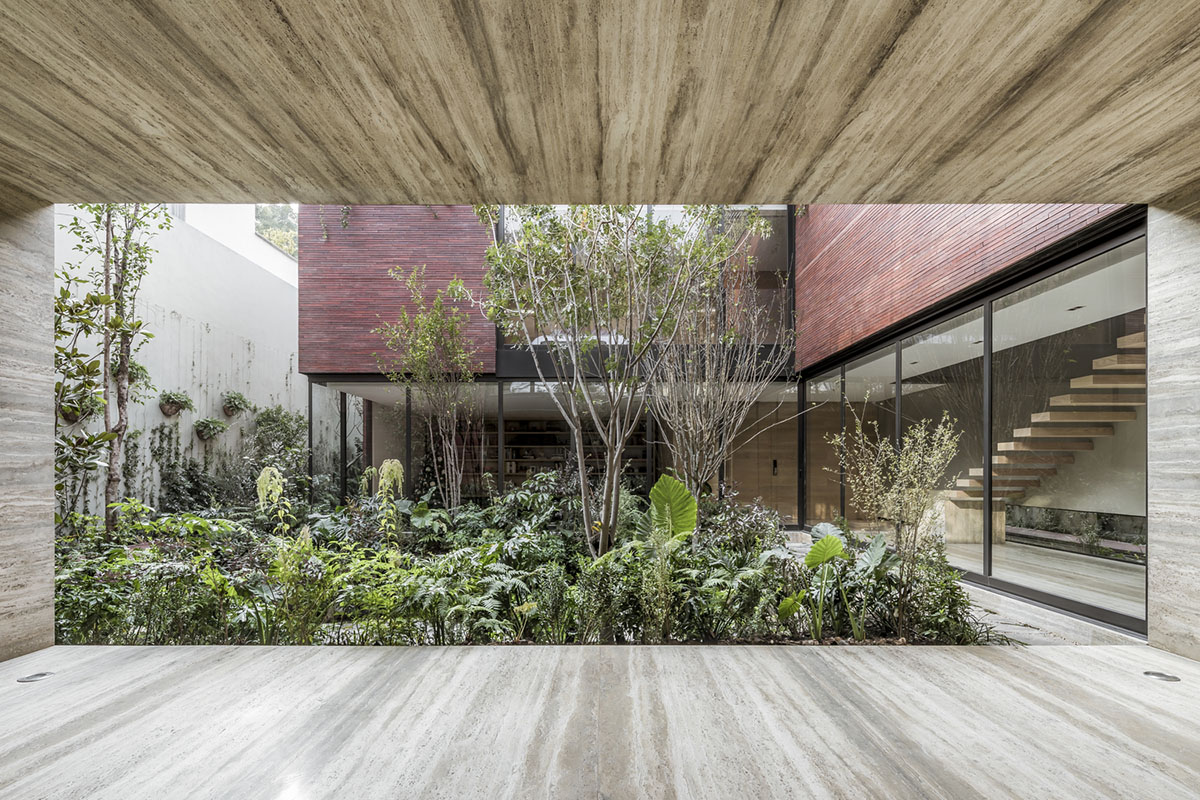 ESRAWE designs house by using red brick pavilion-like volumes in Mexico City