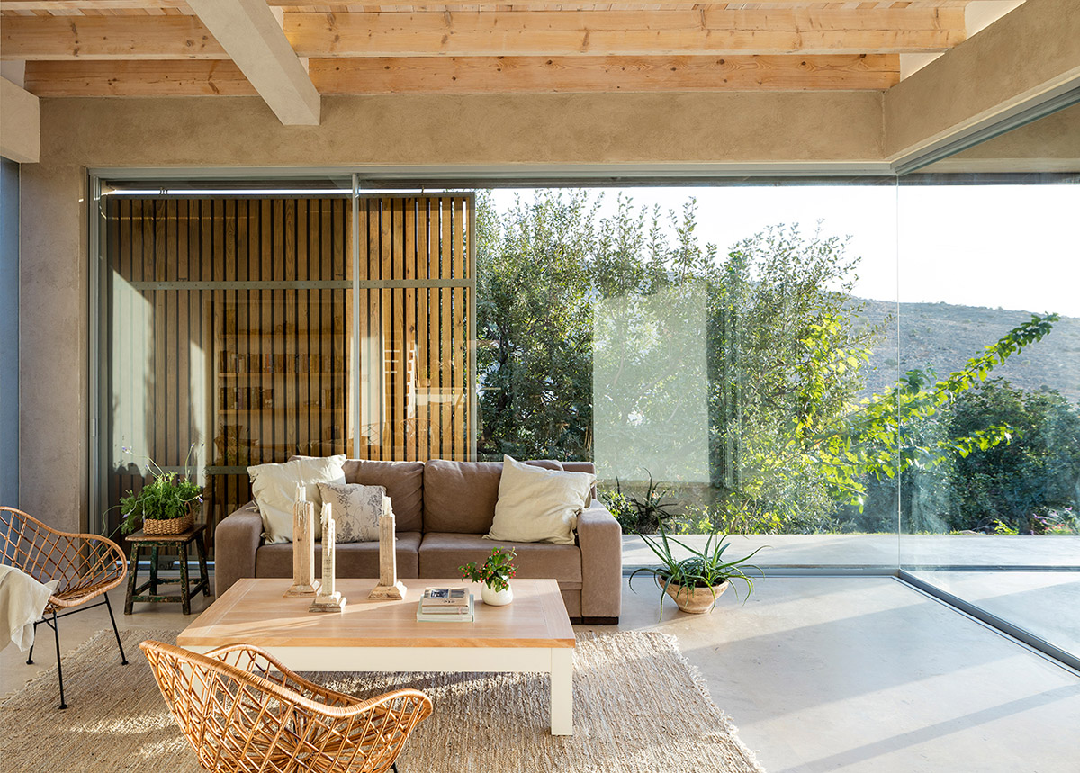 Golany Architects completes concrete private residence with wooden shutters in the Galilee
