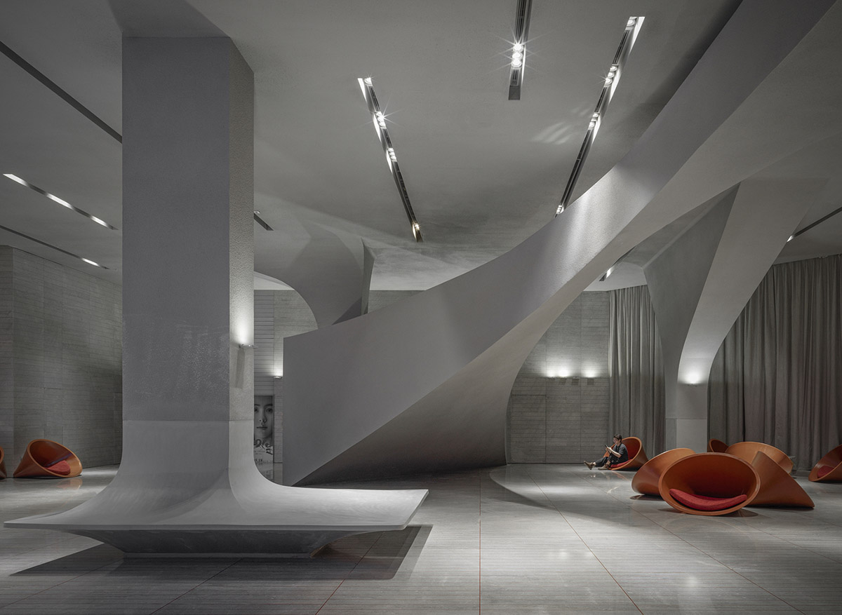 Greyscale interior provides acoustically comfortable space for a cinema by One Plus Partnership