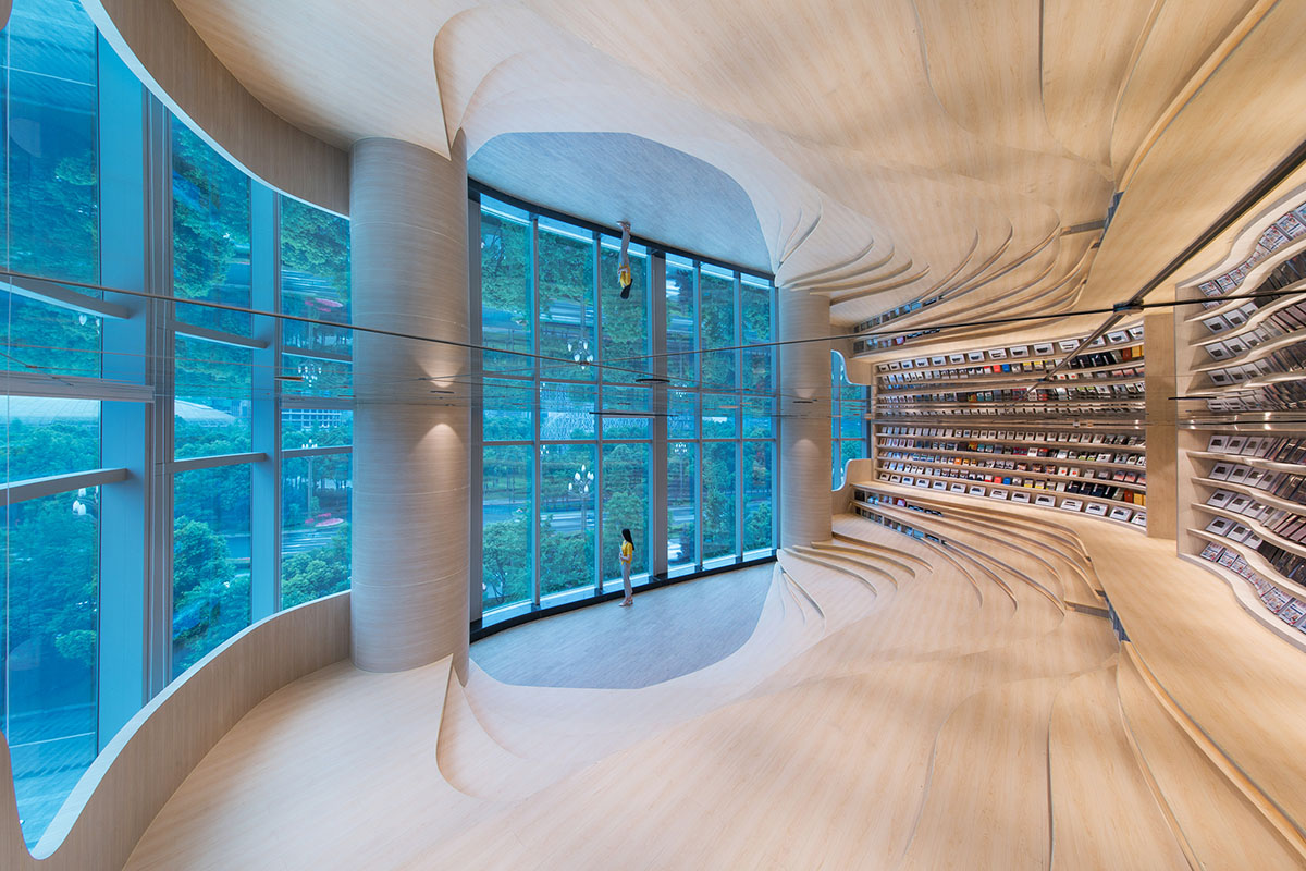 X+Living creates undulating walls and colourful interior for Chengdu Zhongshuge bookstore in China