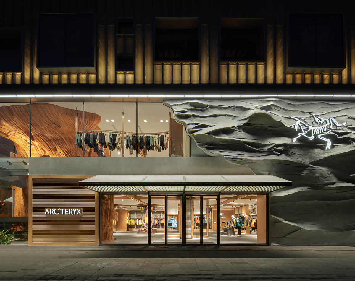 STILL YOUNG creates cave-like interiors for a store with wood and rock elements in Beijing 
