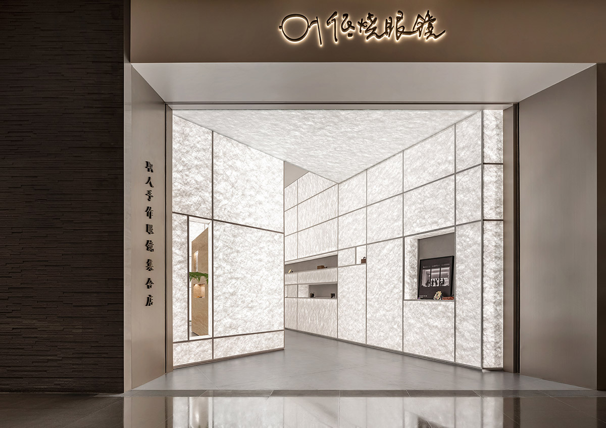 Luminous screen walls create fluid interiors for an optic store designed by Onexn Architects 