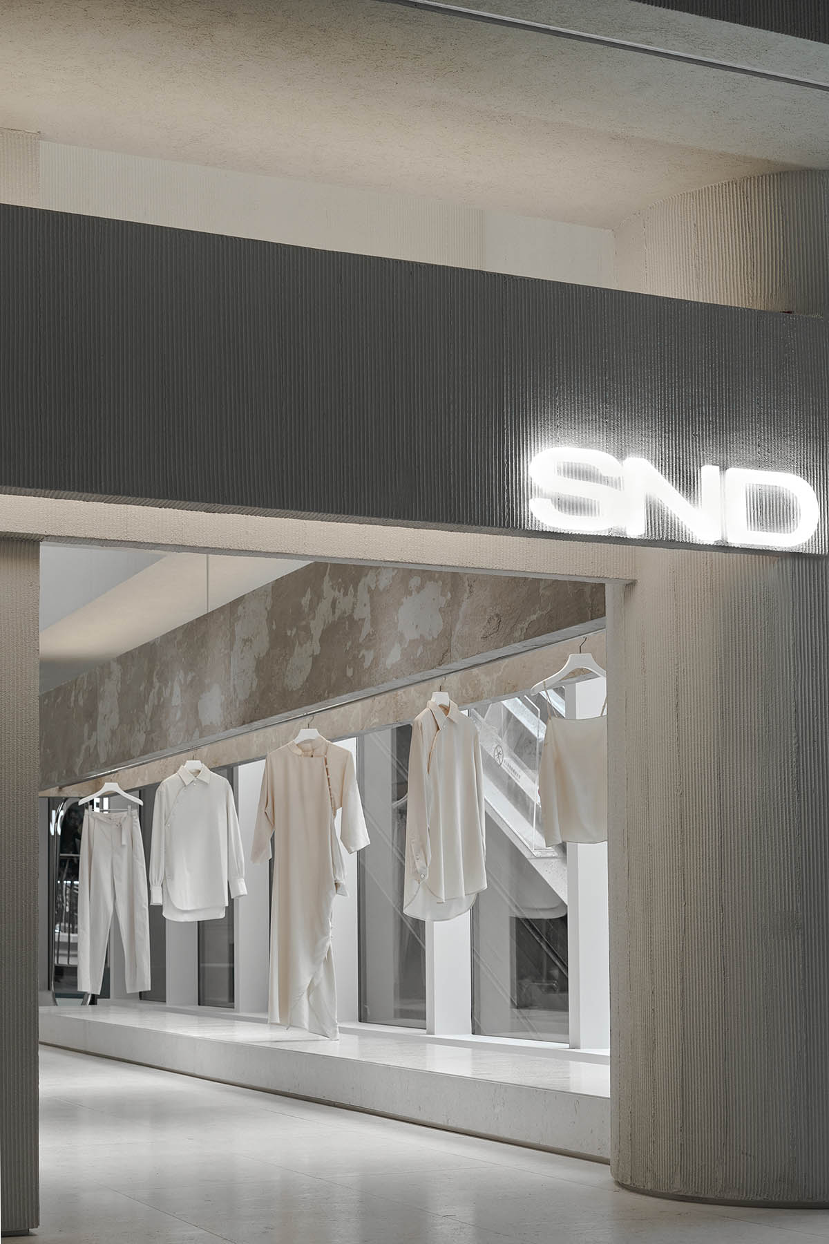 Boutique fashion store by Various Associates is inspired by remaining ancient temples in deserts