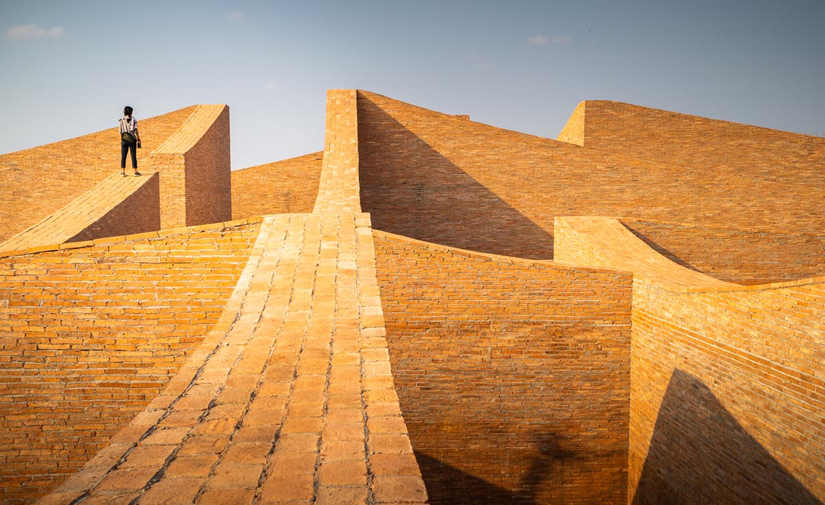 Bangkok Project Studio used over 480,0000 fired clay bricks to form elephant museum with curved walls
