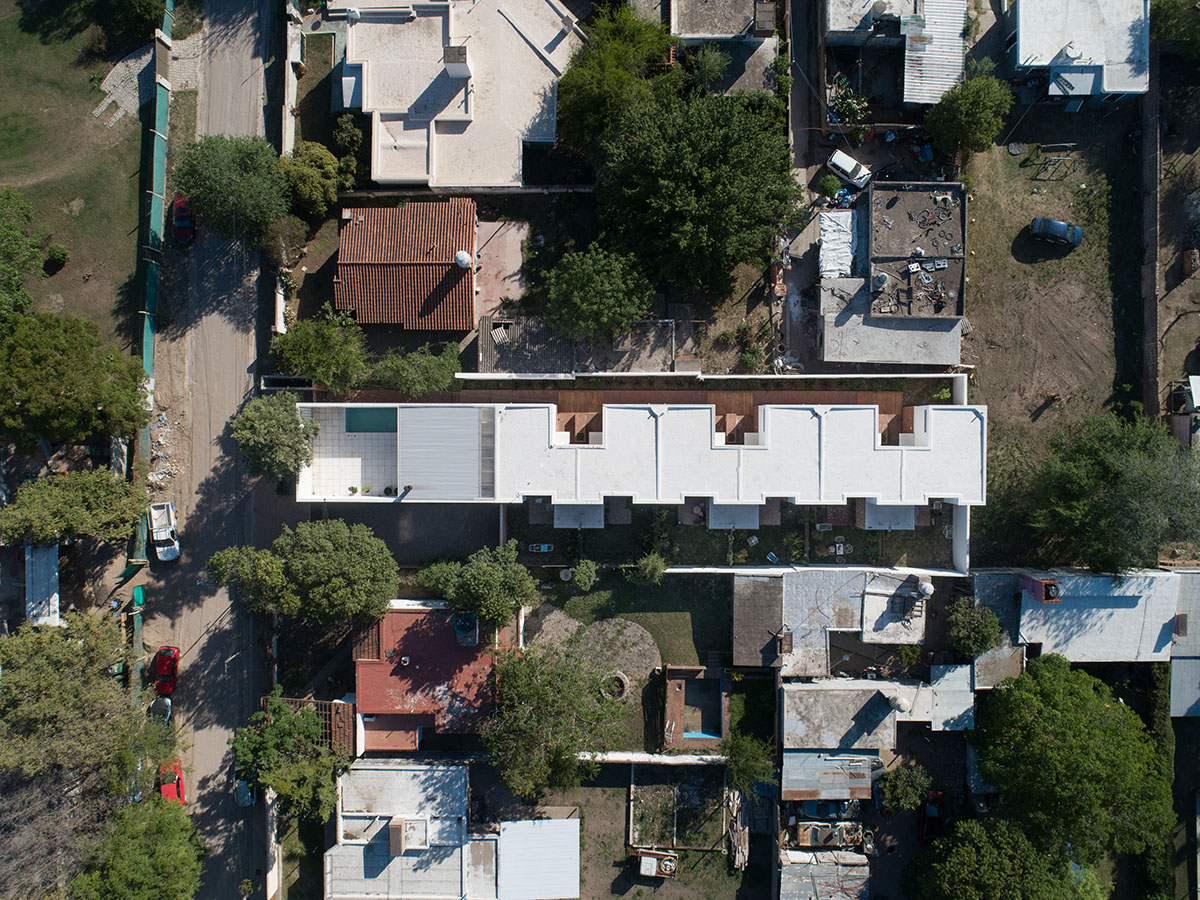 Andres Alonso Architecture Workshop completes La Inesita houses with tall brick base in Cordoba