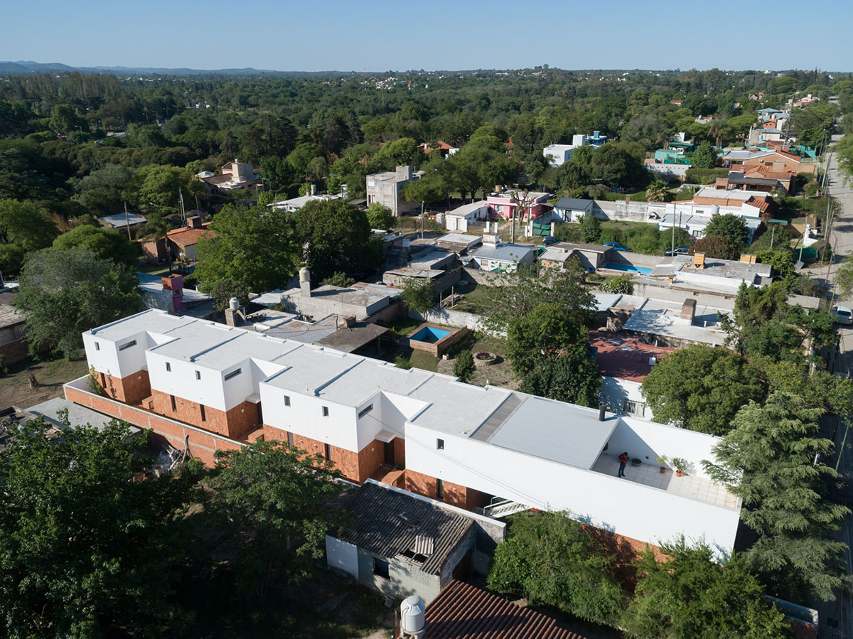 Andres Alonso Architecture Workshop completes La Inesita houses with tall brick base in Cordoba
