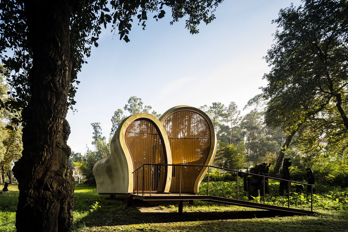 Super small cave-like art gallery by FCC Arquitectura built on lush green in Portugal