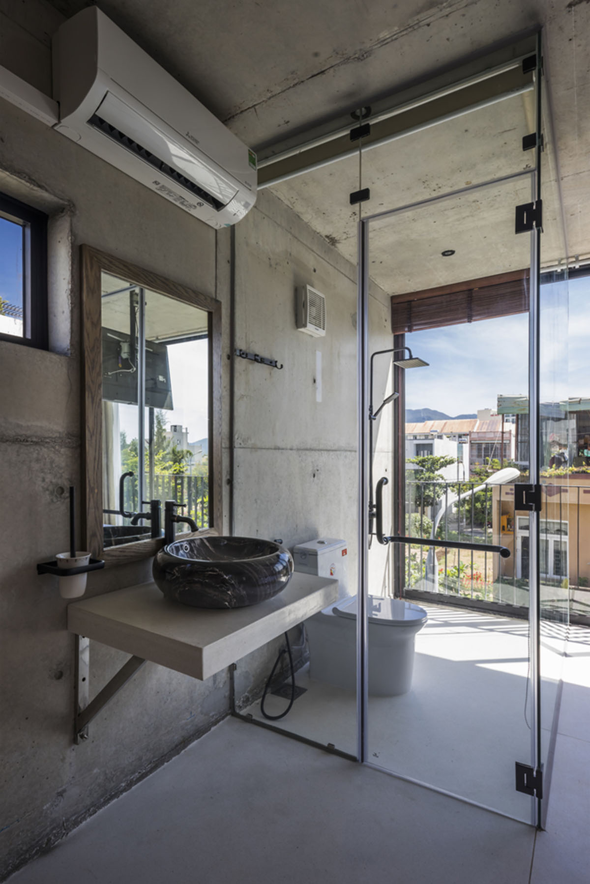 Ho Khue Architects' concrete house is inspired by imaginations of children’s LEGO game in Vietnam