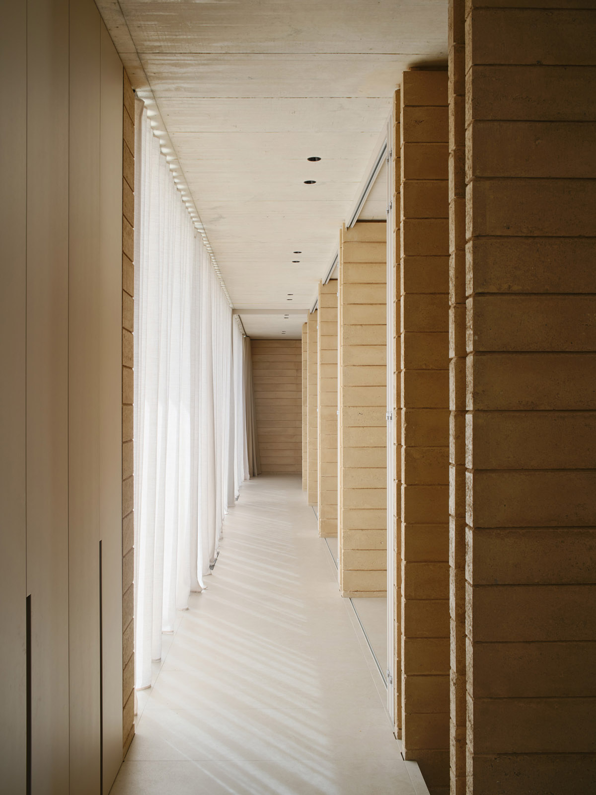 Atheleia Arquitectura completes Casa Artiga with rammed earth walls in Barcelona 