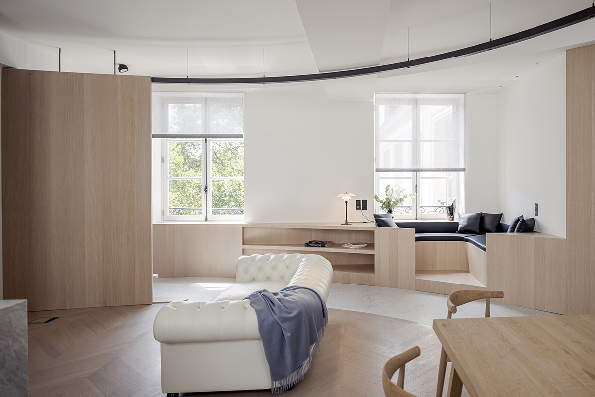 noa* converts 18th century hotel in Paris into an apartment with curved lines and scent of wood