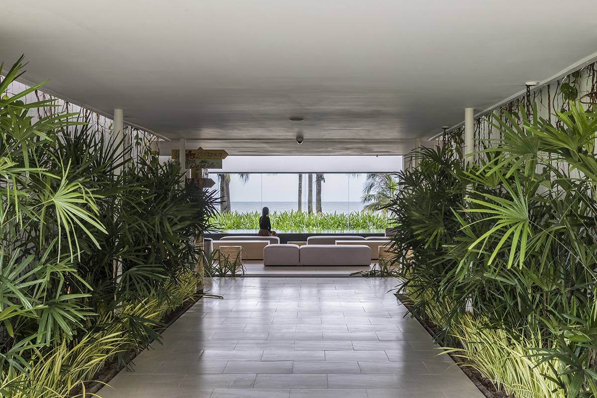 Six landscape boxes form this gallery and showroom by MIA Design Studio in Vietnam