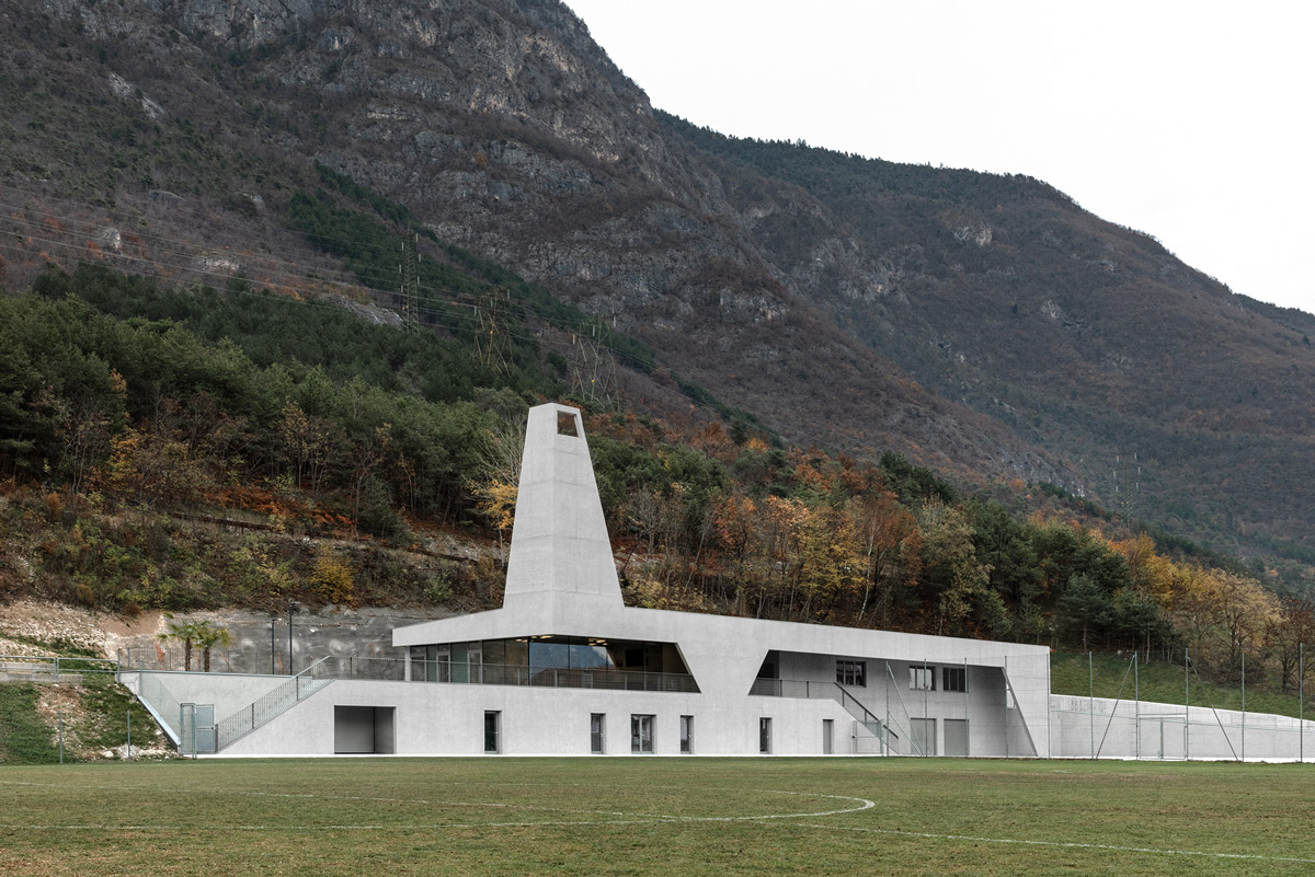 Sports facility by MoDusArchitects makes a bold statement with lighting tower in Bozen, Italy 