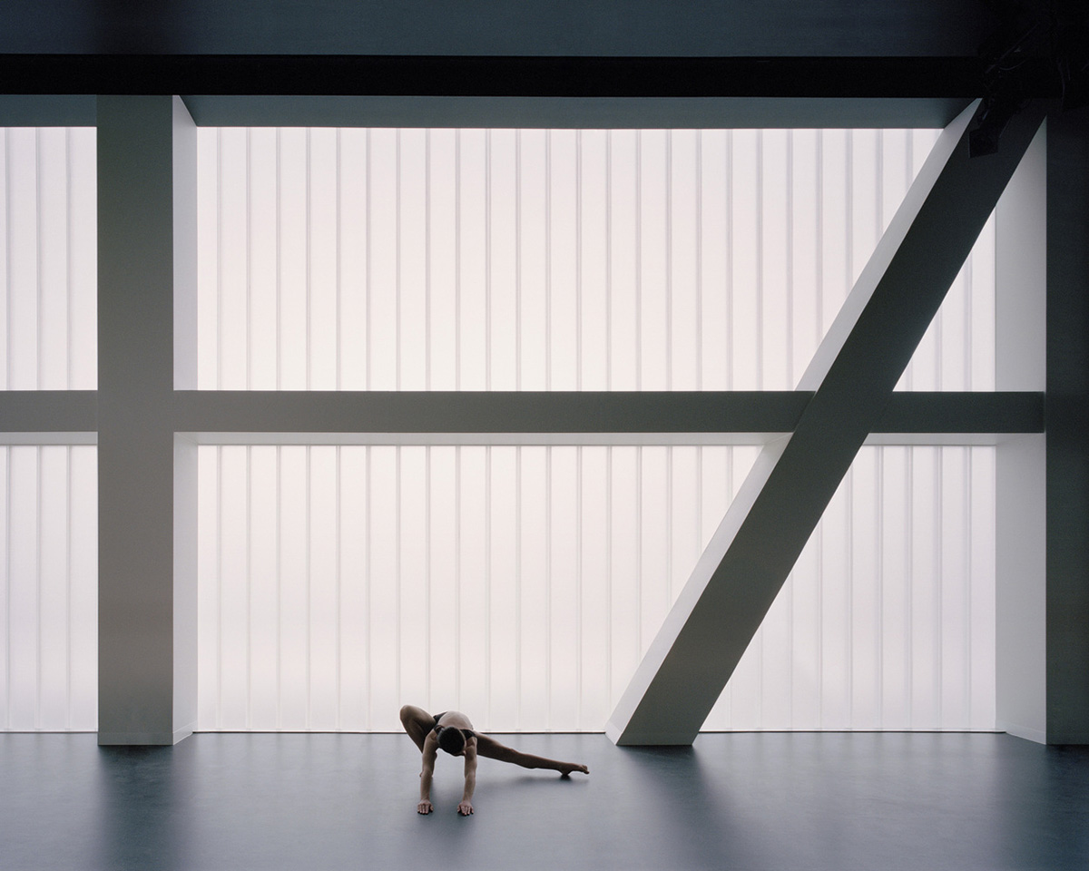 Hassell reveals Arts Centre with sliced translucent volume which is in dialogue with historic church