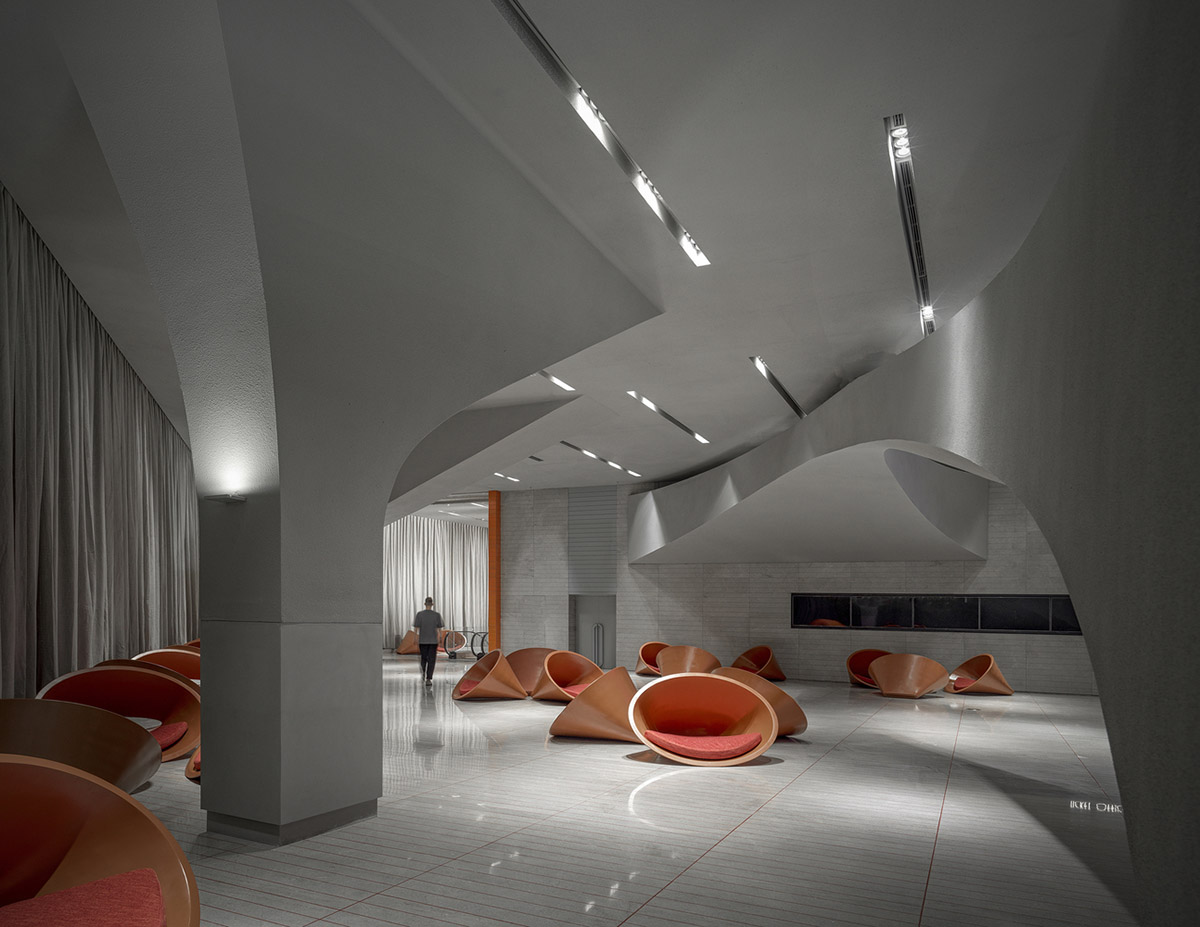 Greyscale interior provides acoustically comfortable space for a cinema by One Plus Partnership