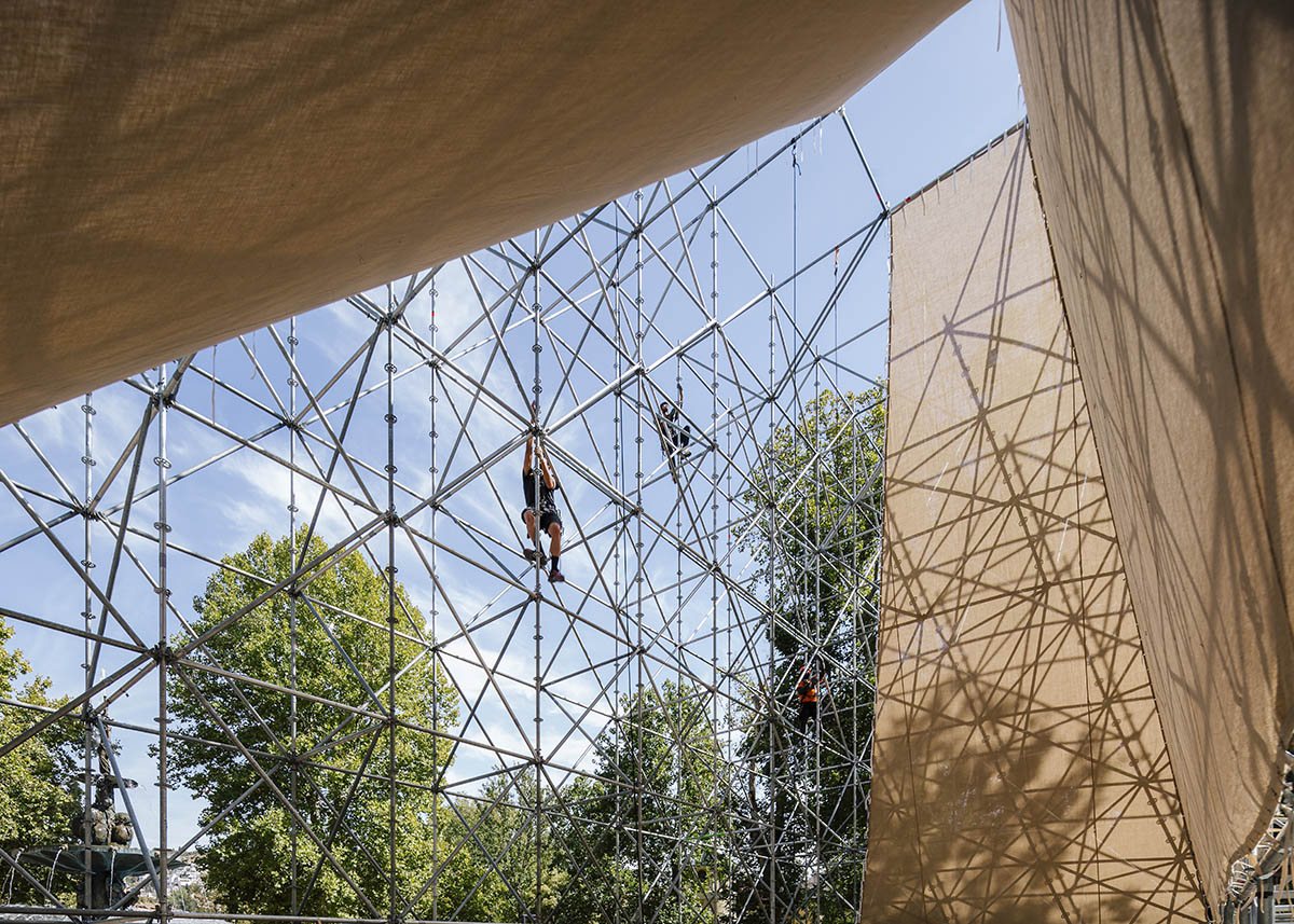 Aire Pavilion wrapped by giant scaffolding represents 